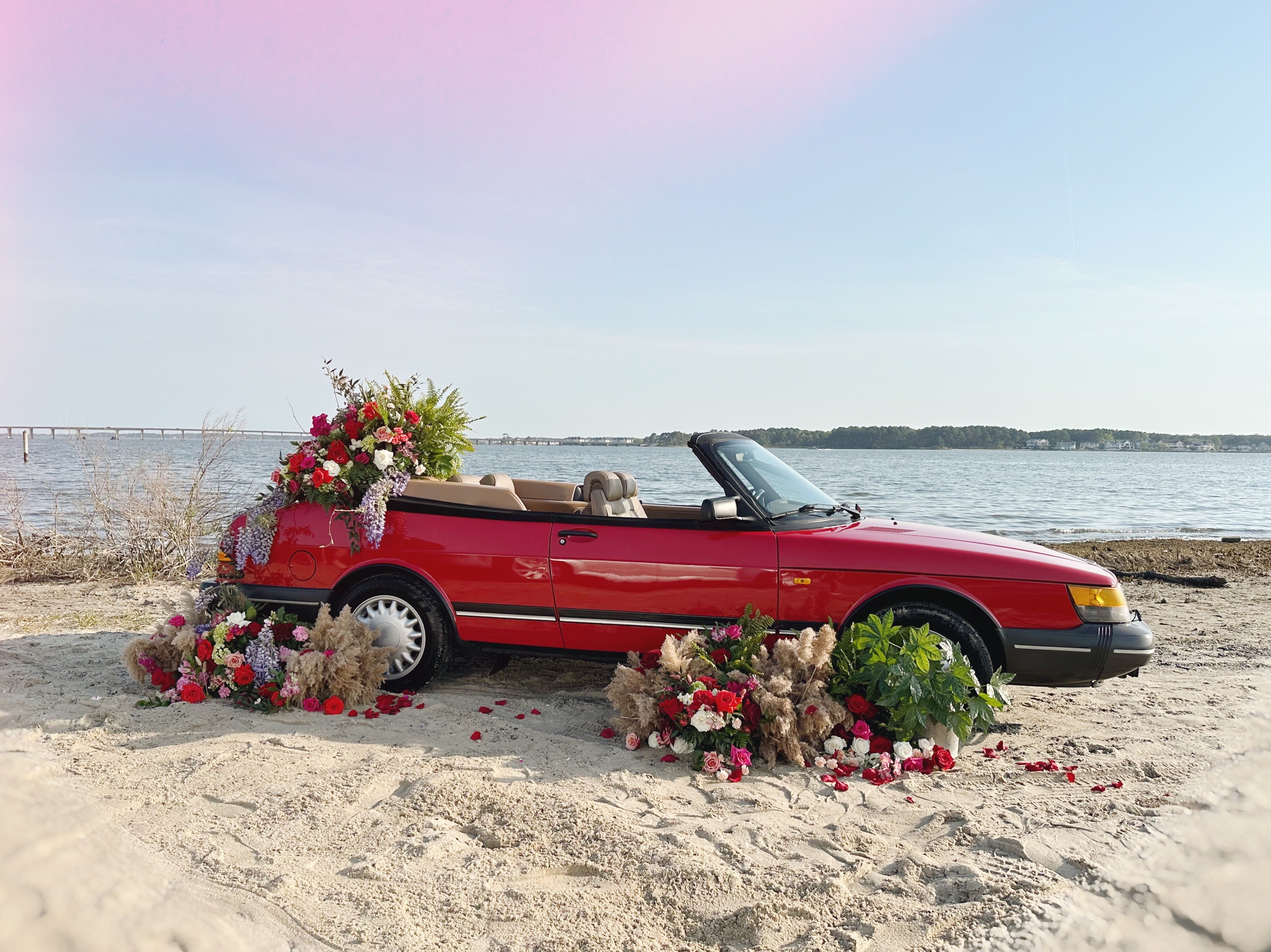 1994 classic saab 900 s covered in flowers // little miss lovely floral design ocean city maryland md wedding florist