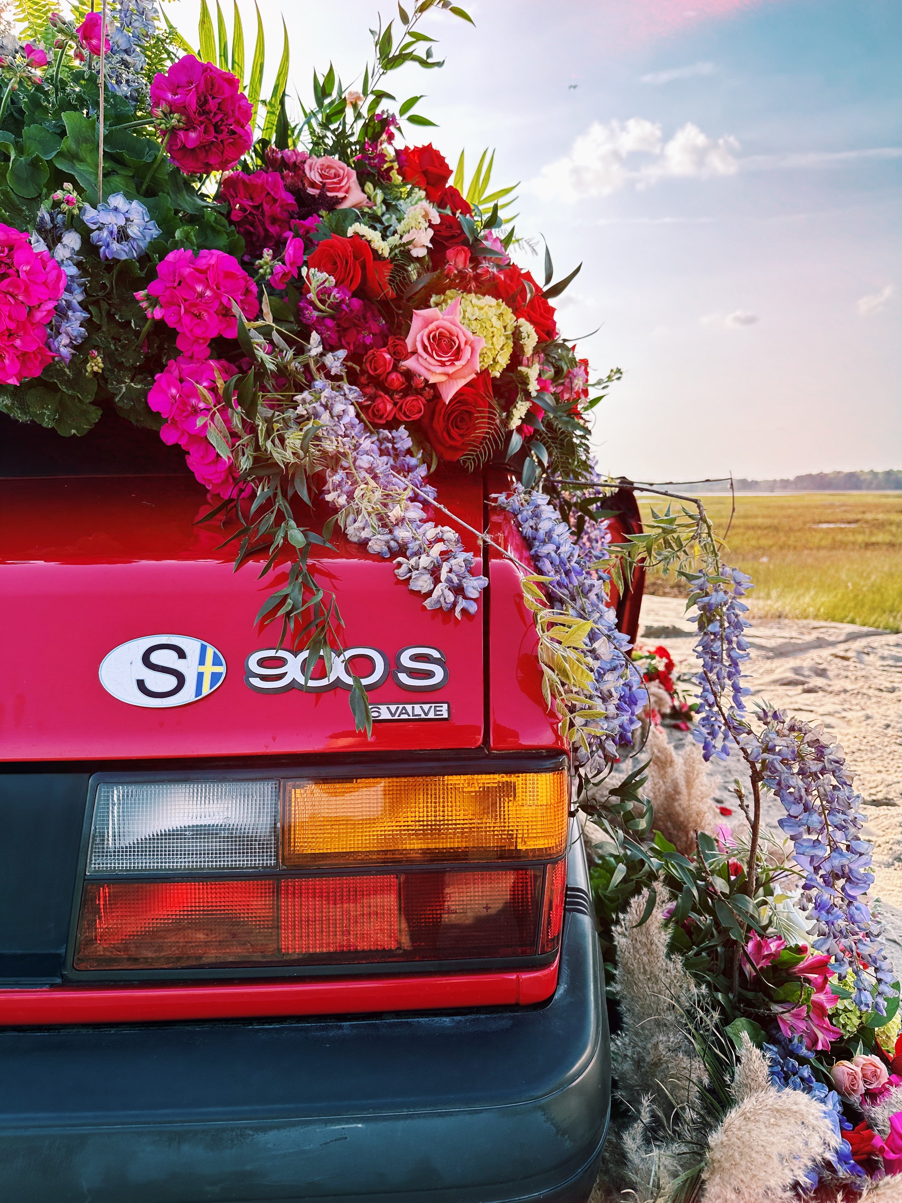 1994 classic saab 900 s covered in flowers // little miss lovely floral design ocean city maryland md wedding florist