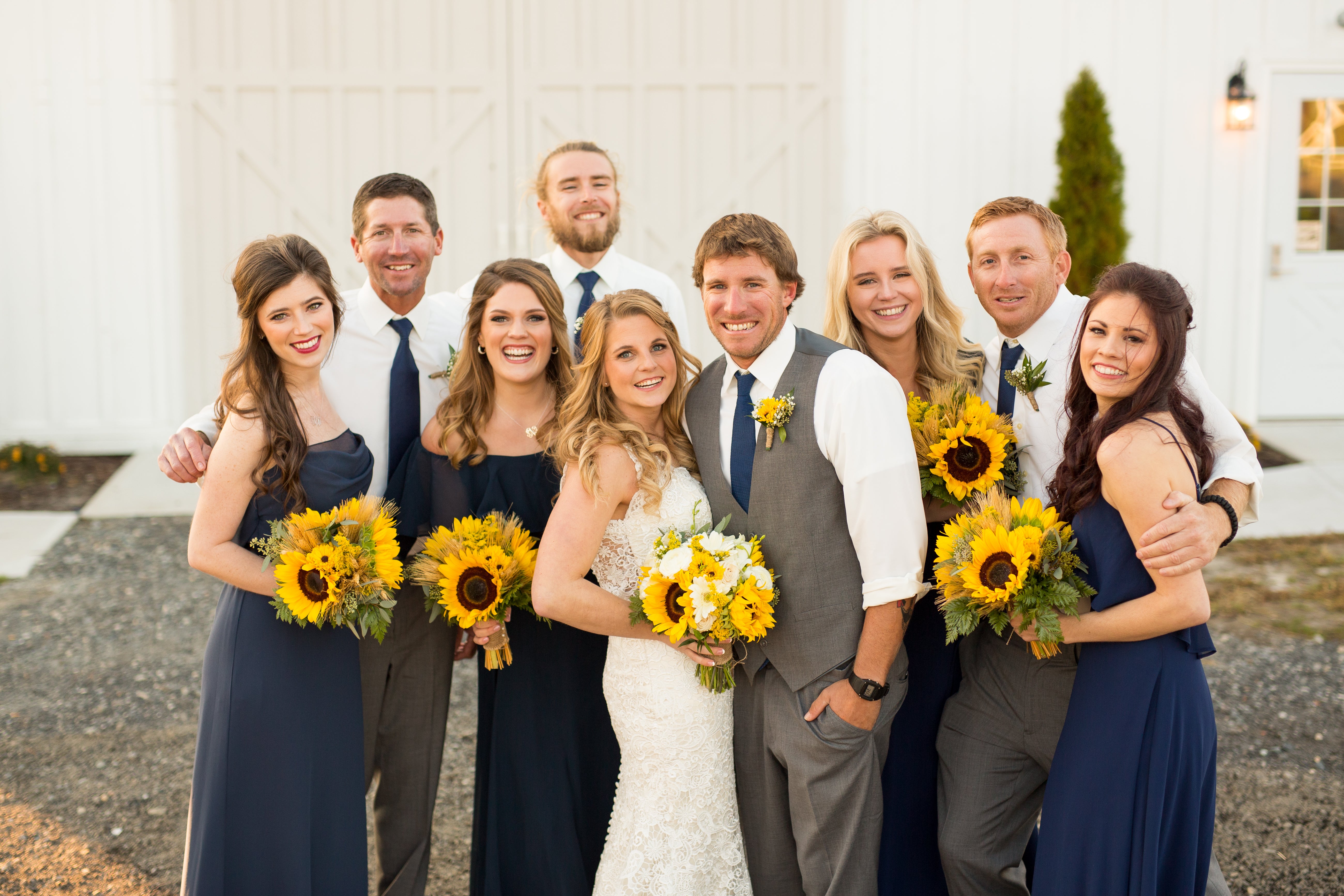 little miss lovely floral design // kylan barn delmar md wedding // rustic sunflower and white rose bouquets wedding flowers