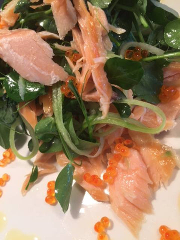 Flaked roast Smoked Salmon with a pea shoot and cucumber salad, fennel dressing and trout caviar