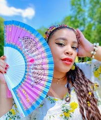 Greivy model and influencer holding Love Lynx Hand-fan