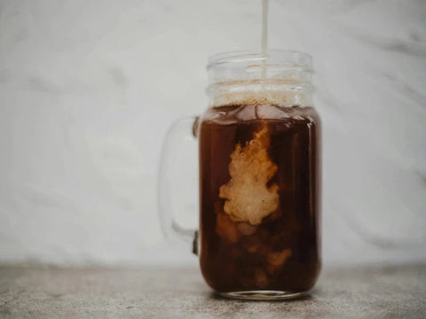 using milk or creamer to add sweetness to coffee