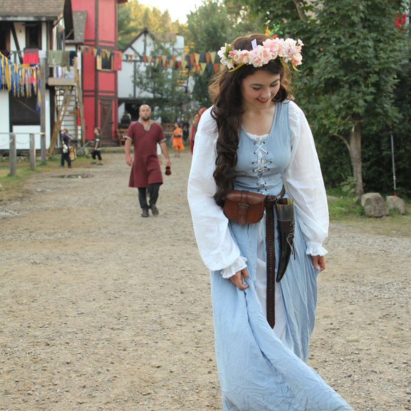 Woman in Renaissance dress walking in the festival