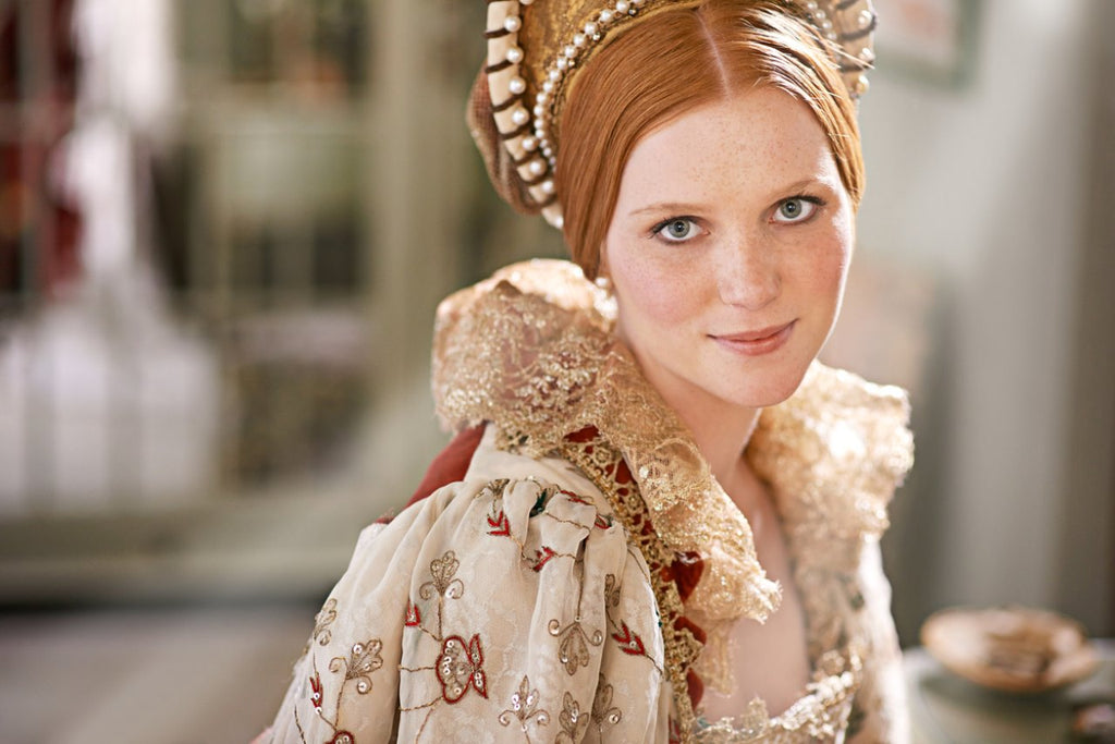woman wearing makeup and renaissance royalty costume