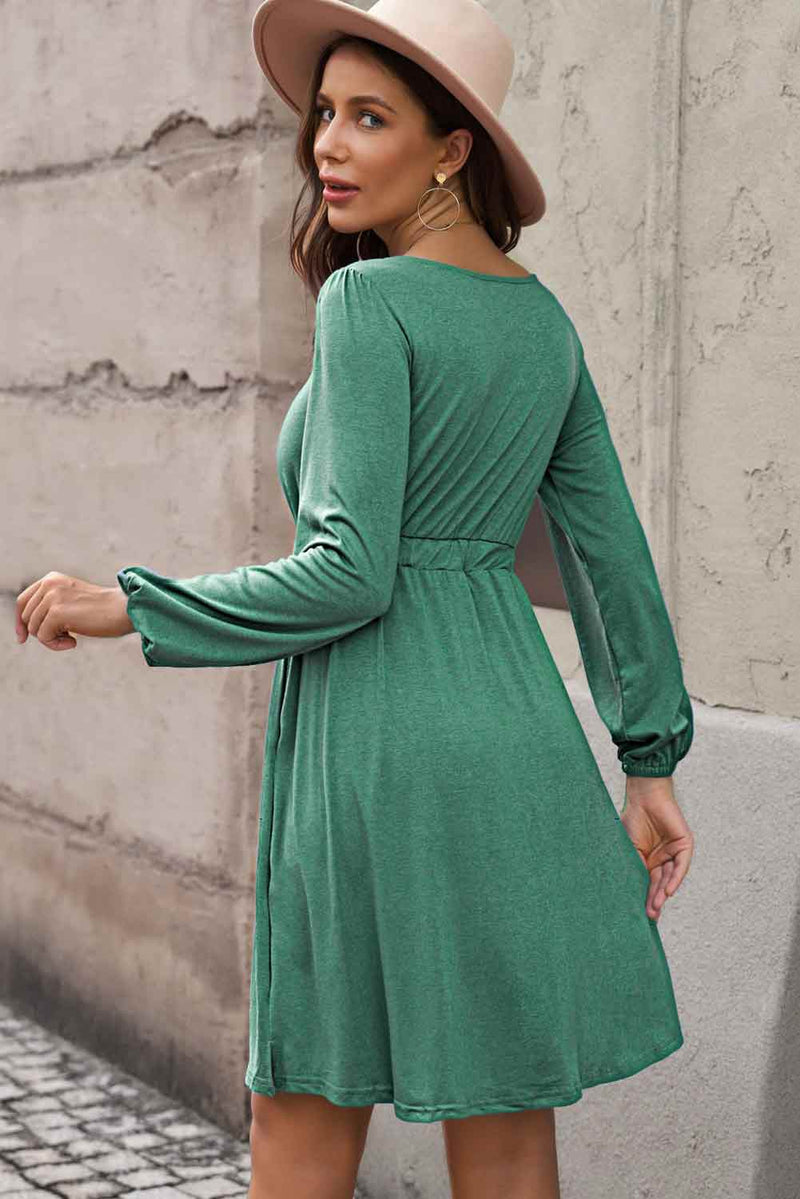 The Sophia Button Dress features stylish buttons down the front and an elastic waistband.