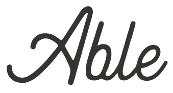 Elegant cursive script of the word 'Able' on a white background.