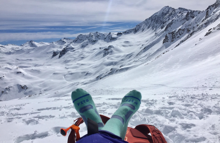 amie engerbretson relaxing on mountain with fits ski socks 