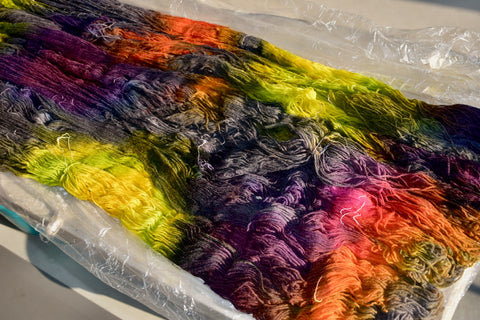 dyed yarn (skeins) canvas on one table 