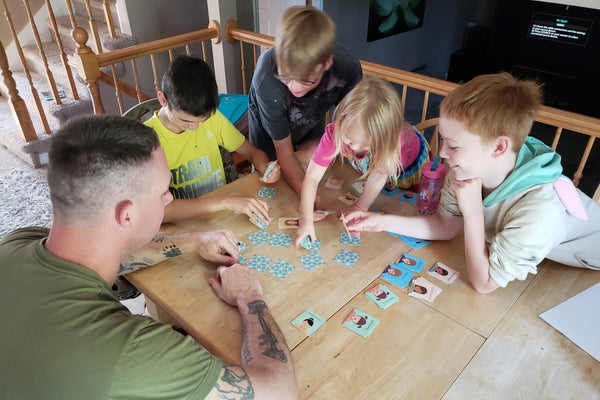 Dad and kids playing with ToolKit tools