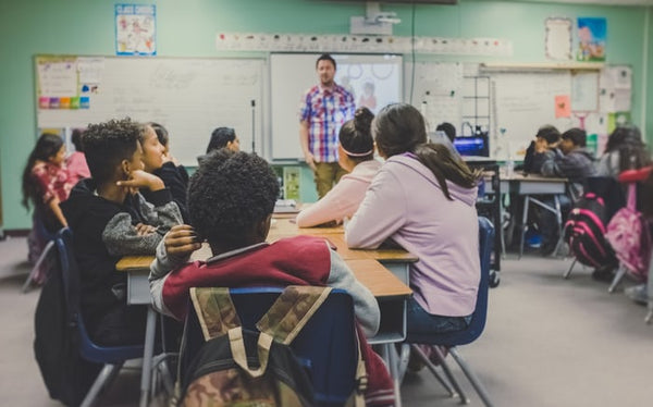 teacher teaching a classroom