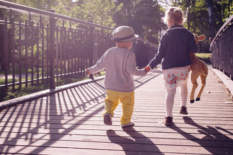 Two children holding hands 