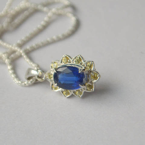 silver sunflower pendant with kyanite
