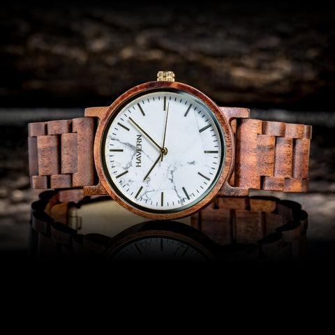 koa wooden watch laying on its side