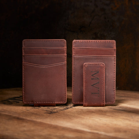 engraved leather money clip on whiskey barrel top