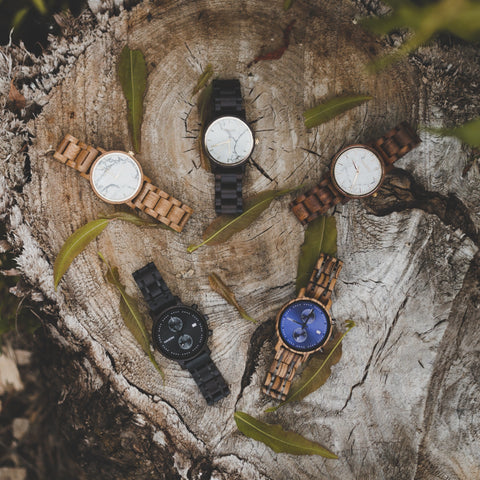 wooden watches laying around in a circle