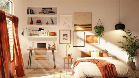 Bedroom with multiple picture frames on the wall and a study area