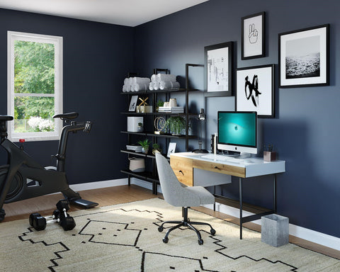 Exercise Room with dark gray walls, exercise bike, and a large area rug