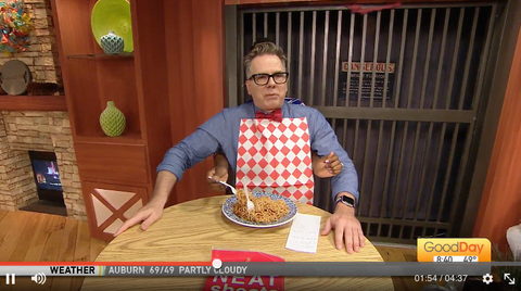 Cody Stark, host of Good Day Sacramento, eating spaghetti during a segment of the show..