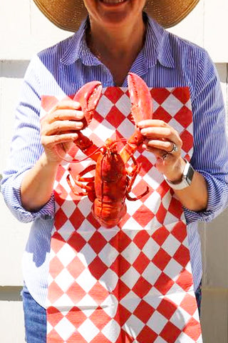 Woman holding a lobster wearing a Red & White Diamond NEATsheet