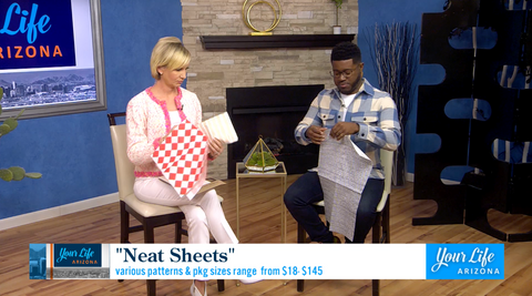 The hosts of Your Life Arizona trying on NEATsheets during a segment airing on National Barbecue Day on May 16, 2022.