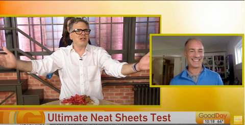 Cody Stark of GoodDay Sacramento reveals his pristine white shirt after eating messy Buffalo wings while wearing NEATsheets.