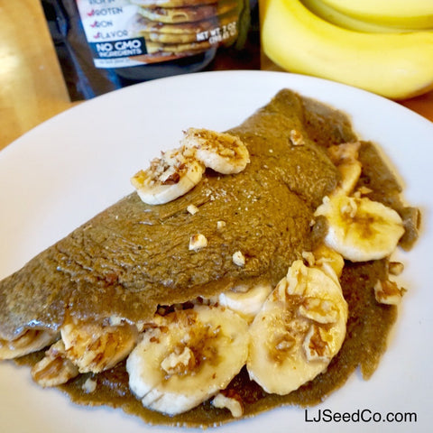 Folded GF pancake with bananas, syrup, and walnuts