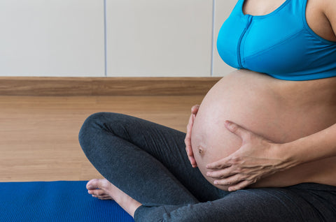 woman who needs maternity supportwear for back