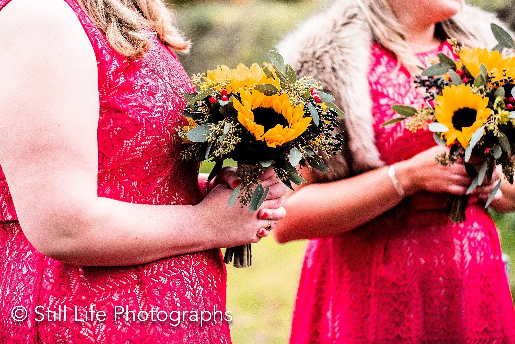 Bridesmaid's hand tied bouquets with Sunflowers and foliage.