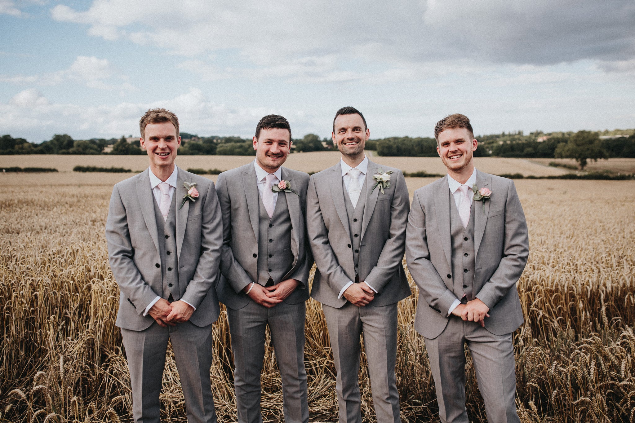 Groom and Groomsmen white Rose buttonholes Wedding