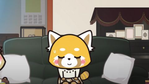 Aggretsuko sitting on a couch