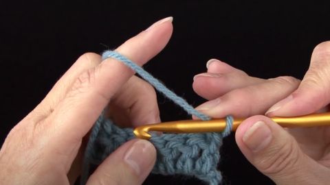 Close-up of hands doing crochet