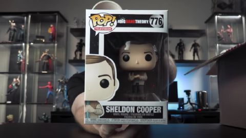 Man Holding Box of Sheldon Cooper Funko Pop