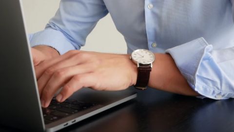 Man Typing on a Laptop