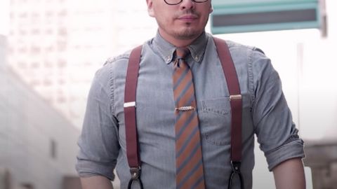 Man Wearing Suit and Suspenders