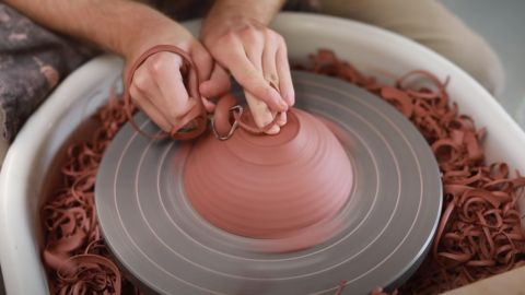Person Making a Stoneware Pottery Bowl