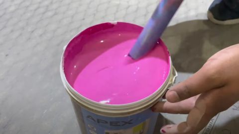 Person Mixing a Paint