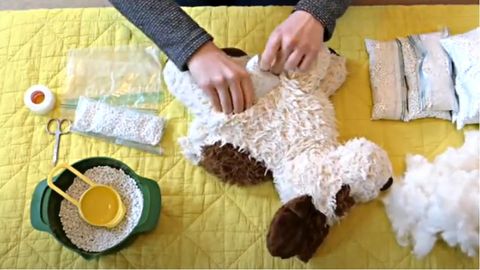filling a stuffed toy with poly plastic pellets