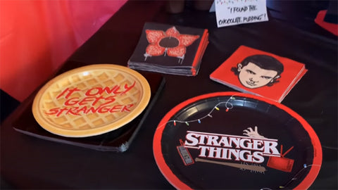 stranger things party favors on a black table