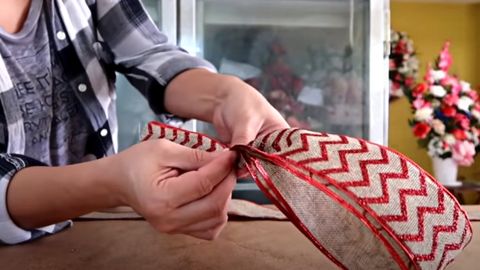 woman making a ribbon