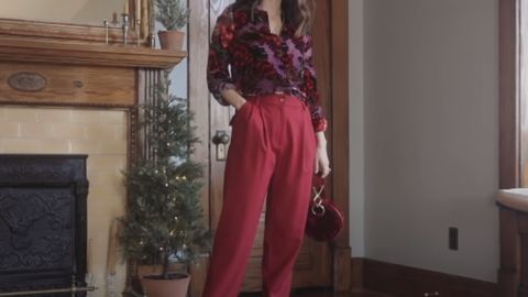 woman wearing a red floral longsleeve shirt and a red pants