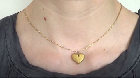 woman wearing heart shaped necklace