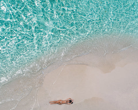 Woman tanning on beach