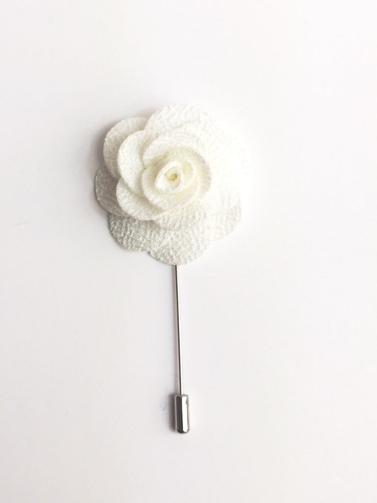 white flower pin