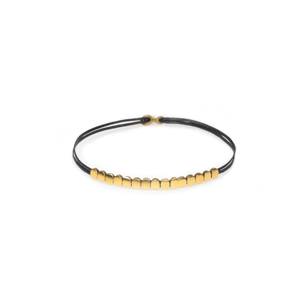 gold bracelet with circle and line through it