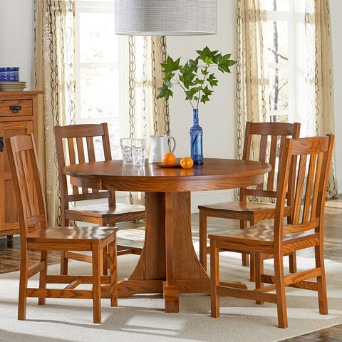 Round mission style oak single pedestal dining table with 4 mission style oak side chairs