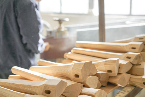 stack of unfinished wood furniture legs