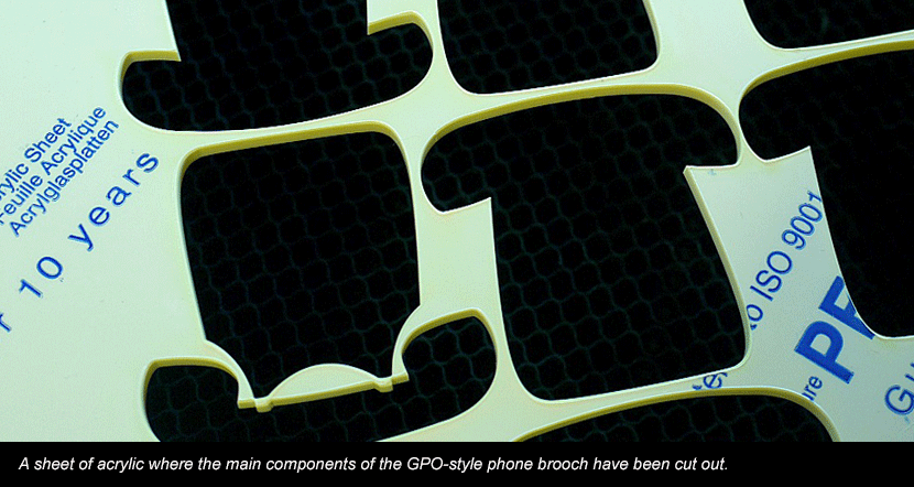 Laser cut sheet of acrylic for GPO-style phone brooches