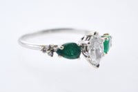 Contemporary Engagement Diamond Ring with Emeralds in Elegant Platinum Setting - $15K VALUE