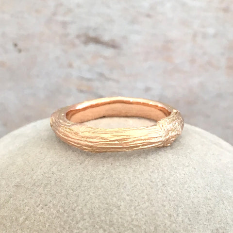 twig ring in 9 carat rose gold with wood grain texture