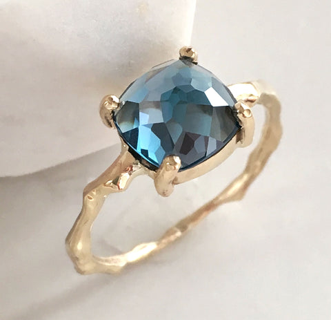 london blue topaz ring with cherry twig detail